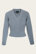 Load image into Gallery viewer, Blue cardigan on a beige background