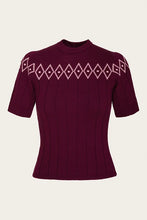 Load image into Gallery viewer, A short-sleeve ribbed knit top in deep burgundy with a light pink diamond pattern across the chest, displayed on a neutral cream background.