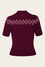 Load image into Gallery viewer, A short-sleeve ribbed knit sweater in deep burgundy with a light pink geometric diamond pattern across the upper chest, shown against a plain off-white background.