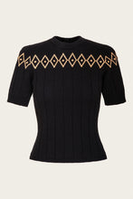 Load image into Gallery viewer, A black short-sleeve ribbed knit sweater featuring a decorative geometric diamond pattern in tan and black across the chest, displayed on a neutral light beige background.