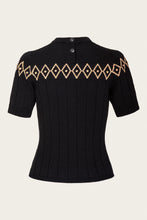 Load image into Gallery viewer, A black short-sleeve ribbed knit top with a decorative beige geometric diamond pattern across the upper chest, displayed on a neutral light beige background.