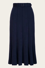 Load image into Gallery viewer, A dark navy blue pleated midi skirt with a matching waistband belt and a small rectangular buckle, shown against a plain light beige background.