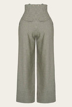 Load image into Gallery viewer, Green and white striped jumpsuit on a light gray background