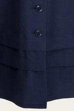 Load image into Gallery viewer, Close-up of a navy blue shirt with buttons on a white background