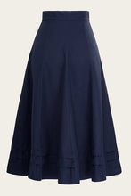 Load image into Gallery viewer, Navy blue skirt with ruffled layers on a beige background
