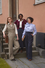 Load image into Gallery viewer, Three women standing on a set of stairs in front of a building.