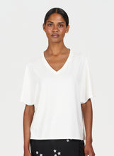 Load image into Gallery viewer, Woman wearing a white blouse with a plain background
