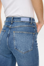 Load image into Gallery viewer, Close-up of blue jeans with a white background