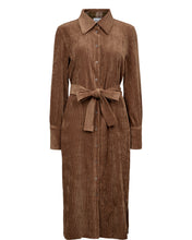 Load image into Gallery viewer, A brown corderoy long-sleeve button-down shirt dress with a matching tie belt at the waist, shown on a plain white background.