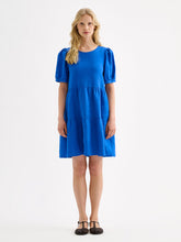 Load image into Gallery viewer, Woman wearing a blue dress on a white background