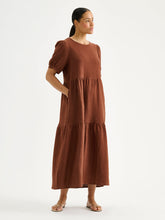 Load image into Gallery viewer, Woman wearing a brown dress on a white background