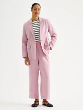 Load image into Gallery viewer, Person wearing a pink suit with a striped shirt on a white background