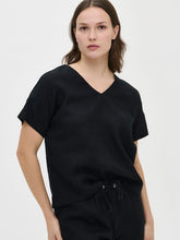 Load image into Gallery viewer, Woman wearing a black outfit on a white background
