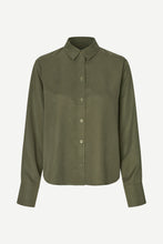 Load image into Gallery viewer, An olive green long-sleeve button-up shirt with a classic collar, displayed on a clean, light gray background.