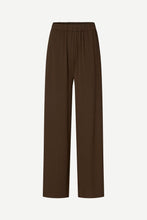 Load image into Gallery viewer, A pair of dark brown wide-leg trousers with an elastic waistband, shown flat against a light gray background.