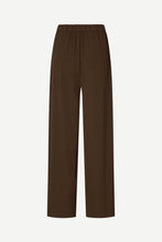 Load image into Gallery viewer, A pair of dark brown wide-leg cropped pants with an elastic waistband, shown against a plain light gray background.