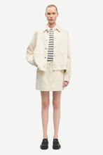 Load image into Gallery viewer, Person wearing a cream jacket, skirt, and striped shirt on a white background