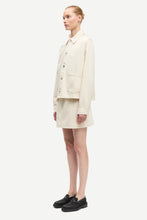 Load image into Gallery viewer, Person wearing a beige coat and skirt set on a white background