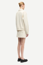 Load image into Gallery viewer, Person wearing a beige outfit on a white background