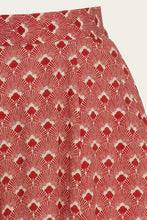 Load image into Gallery viewer, Red and white patterned fabric on a plain background