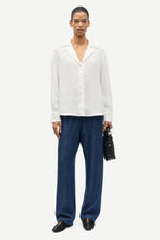 Load image into Gallery viewer, Person wearing a white shirt and blue pants on a white background